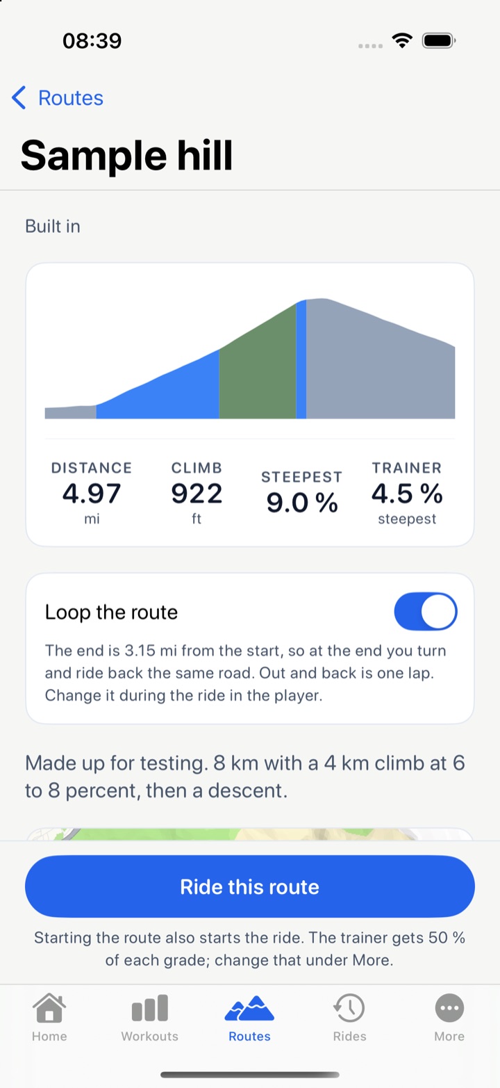 The Sample hill route page: a profile colored gray, blue, and green by grade, 4.97 miles, 922 feet of climb, 9.0 percent at the steepest, 4.5 percent for the trainer, a Loop the route switch, and a Ride this route button.